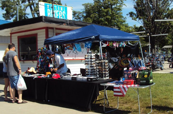 Bart’s first business setup in Geneva-on-the-Lake in 2012: a blue tent and folding tables displaying merchandise